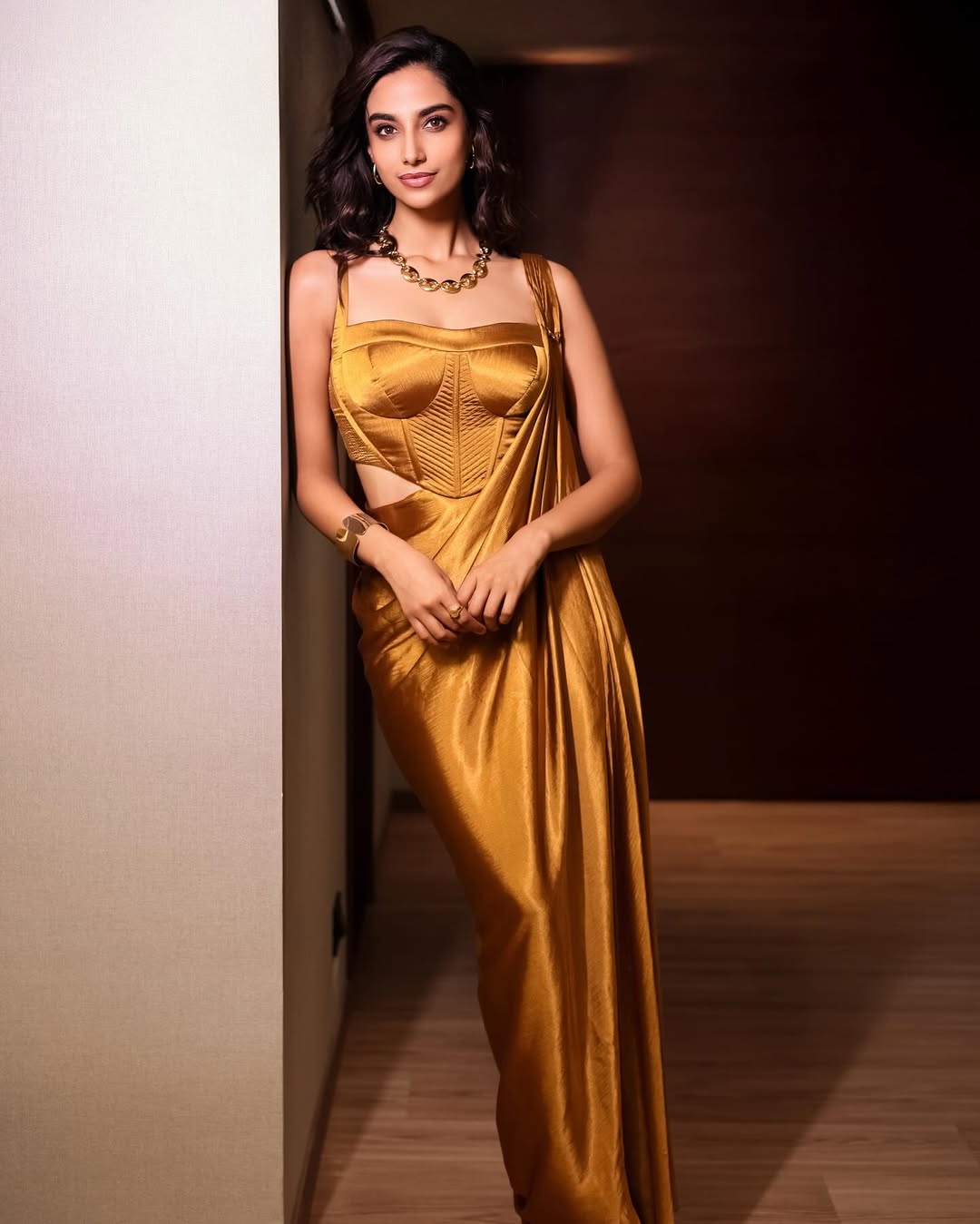 Meenakshi Chaudhary Glows in Golden Outfit