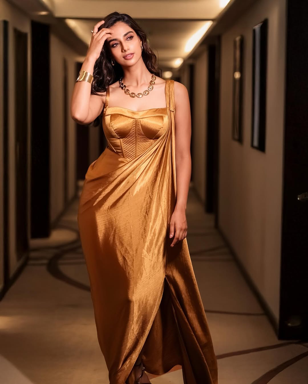 Meenakshi Chaudhary Glows in Golden Outfit